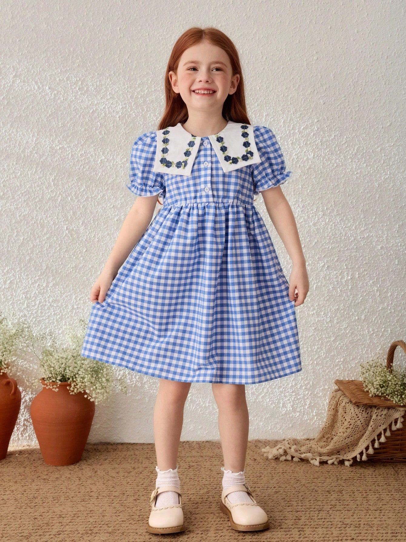 Young girl gingham blue dress with Peter Pan collar
