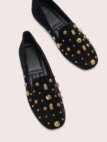 Black loafers with gold detail
