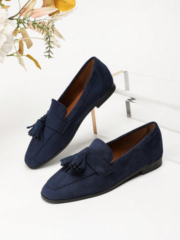Navy tassel loafers