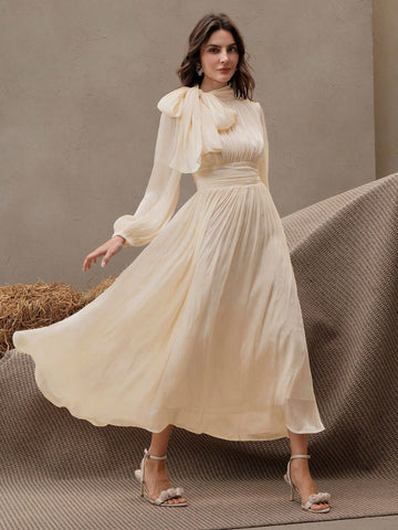 Cream waisted bow dress