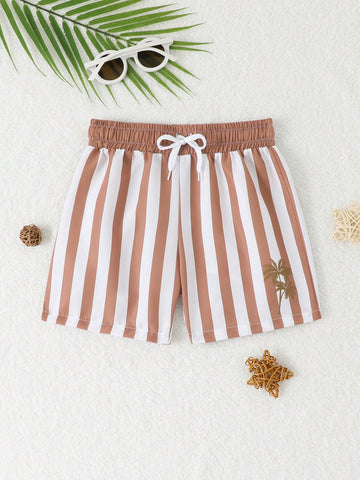 Young boy striped swim shorts