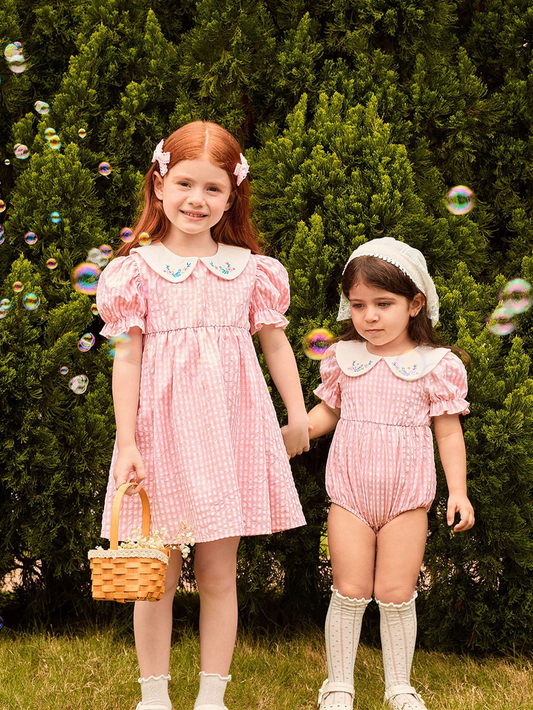 Peach smocked romper with floral collar