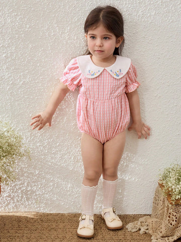 Peach smocked romper with floral collar