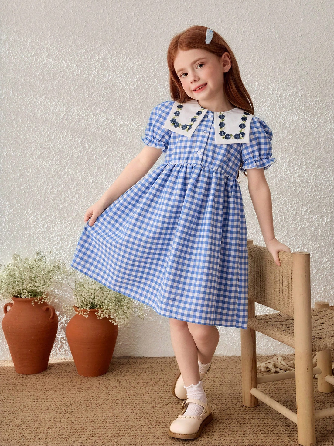 Young girl gingham blue dress with Peter Pan collar Young girl gingham blue dress with Peter Pan collar