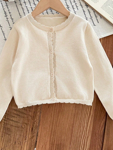 Young girls cream ruffle cardigan